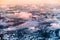 Aerial view of snowy landscape in winter with mountains and lakes in Norway at sunset