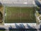 Aerial view of a soccer field in a public park inside a town