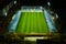 Aerial view of soccer or football field while athletes or players are training at night under bright stadium lights