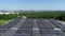 Aerial view of solar energy panels on a roof of a building. Power plant of photovoltaic, solar cell