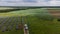 Aerial view of Solar Panels Farm solar cell with sunlight. Drone flight over solar panels field, renewable green