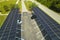 Aerial view of solar panels installed as shade roof over parking lot for parked cars for effective generation of clean