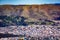 Aerial view of South San Francisco with a historic sign on a hillside of San Bruno Mountains overlooking the city