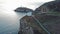 Aerial view of South Stack with lighthouse and cliffs during sunset