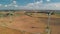 Aerial view of spinning wind turbines