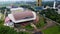 Aerial view of sport arena and mosque in Bandung, Indonesia and noise cloud. Bandung, Indonesia - 04 22 2021