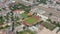 Aerial view of sports centrum in urban neighbourhood. Tilt up footage reveal large city. Berlin, Germany