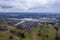 Aerial view of a sprawling industrial complex, with a large manufacturing facility in the