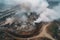 aerial view of sprawling landfill, with smoke and steam rising from the trash