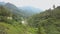 Aerial View Steam Comes Out of the Ground in a Green Forest, Around a Mountain and a River