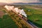 aerial view of steam locomotive traveling through countryside