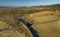 Aerial View of a Steam Passenger Train Rounding a Curve, Blowing Smoke and Steam