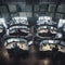 Aerial view of stock exchange with traders at desks and computer screens representing modern technology of finance