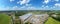 Aerial view of storage and freight terminal with trucks and containers. Industrial background. Logistic center