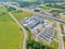 Aerial view of storage and freight terminal with trucks and containers. Industrial background. Logistic center