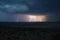 aerial view of storm approaching, with lightning and thunderstorms in the sky