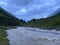 Aerial view stormy mountain river evening landscape