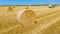 Aerial view of straw bale on farm field