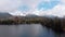 Aerial view of Strbske Pleso, Slovakia. Mountain Lake in Clouds and Snowy Tatras Mountains