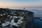 Aerial view Stromboli village from above - see and Strombolicchio at sunset