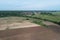 Aerial view of `Studentsy` village and ploughed land from the birds sight, Podolsk region, Russia