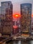 Aerial view of stunning ball of sun creating deep orange sunset over Chicago Loop