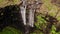 Aerial view of stunning waterfall in Faroe Islands. Aerial view of Fossa waterfall. Cloudy weather,establishing shot, no