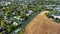 Aerial View Suburb Houses Trees Cars Field Pennsylvania 4K