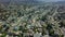 Aerial view of a suburban neighborhood whit mountain. move drone panoram. California in sunny day