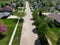 Aerial view of a suburban street on a summer day