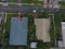 Aerial view of suburbs houses with metal roofs.