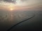 Aerial view Sultan Abdul Halim Muadzam Shah Bridge in sunset near fish far,