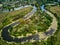 Aerial view of summer cottages surrounded by a winding lake