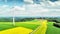 Aerial view of summer countryside with wind turbines and agricultural fields