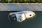 Aerial view of sunken sailboat on shallow bay waters after hurricane in Manasota, Florida