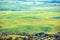 Aerial view of sunny fields on rolling hills in Tuscany, Italy