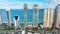 Aerial view of Sunny Isles Beach city with congested street traffic and luxurious highrise hotels and condos on Atlantic