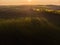 Aerial view of sunrise ofer green grain field