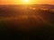 Aerial view of sunrise ofer green grain field
