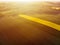 Aerial view of sunrise ofer yellow colza and green grain field