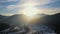 Aerial view Sunrise in the snow-capped mountains. Morning frost in the mountains covered with light fog