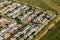 Aerial view at sunrise of suburban housing in neighborhood on Long Island