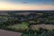 Aerial view at sunset looking north west across the railway viaduct  in Chappel and Wakes Colne in Essex, England