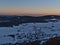 Aerial view after sunset from observation tower on Schauinsland peak over the south of Black Forest with small village.