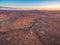 Aerial view of sunset over alien martian-like red landscape.