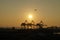 Aerial view of Sunset, Shipping Cranes, Matson Shipping Boat, and Airplane flying in the air