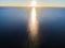 Aerial view of a Sunset sky background. Aerial Dramatic gold sunset sky with evening sky clouds over the sea. Stunning sky clouds