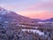 Aerial view of a sunset sky over the snowy Reservat Zelenci in Triglav national park, Slovenia