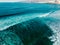 Aerial view surfers in crystal clear water, Tenerife Canary islands