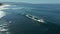 Aerial view of surfers in the water at Banzai Pipeline beach on North Shore of Oahu